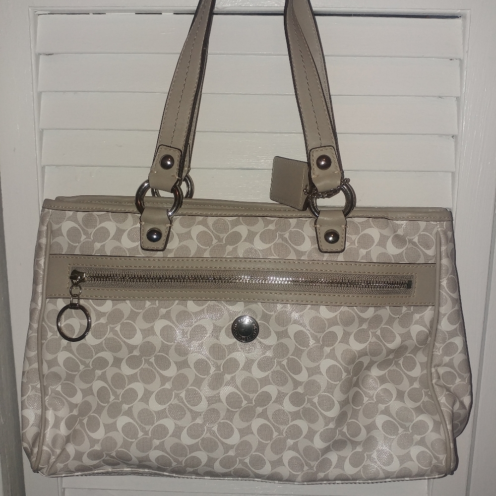 Gray and white coach handbag